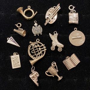 Thirteen Sterling Silver ‘School’ Charms
